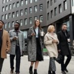 coworkers taking a coffee break and walking