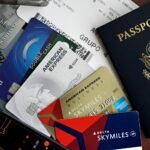 travel essentials passport credit cards and boarding pass - How to Get Insurance as a Traveler in France